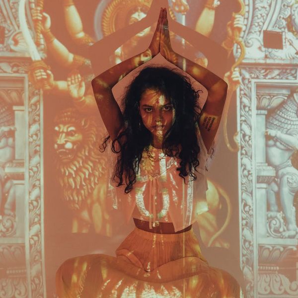 Woman in a calm yoga pose, symbolizing balance and inner peace.